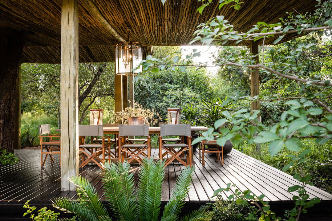 singita ebony lodge villa deck with tables and chairs