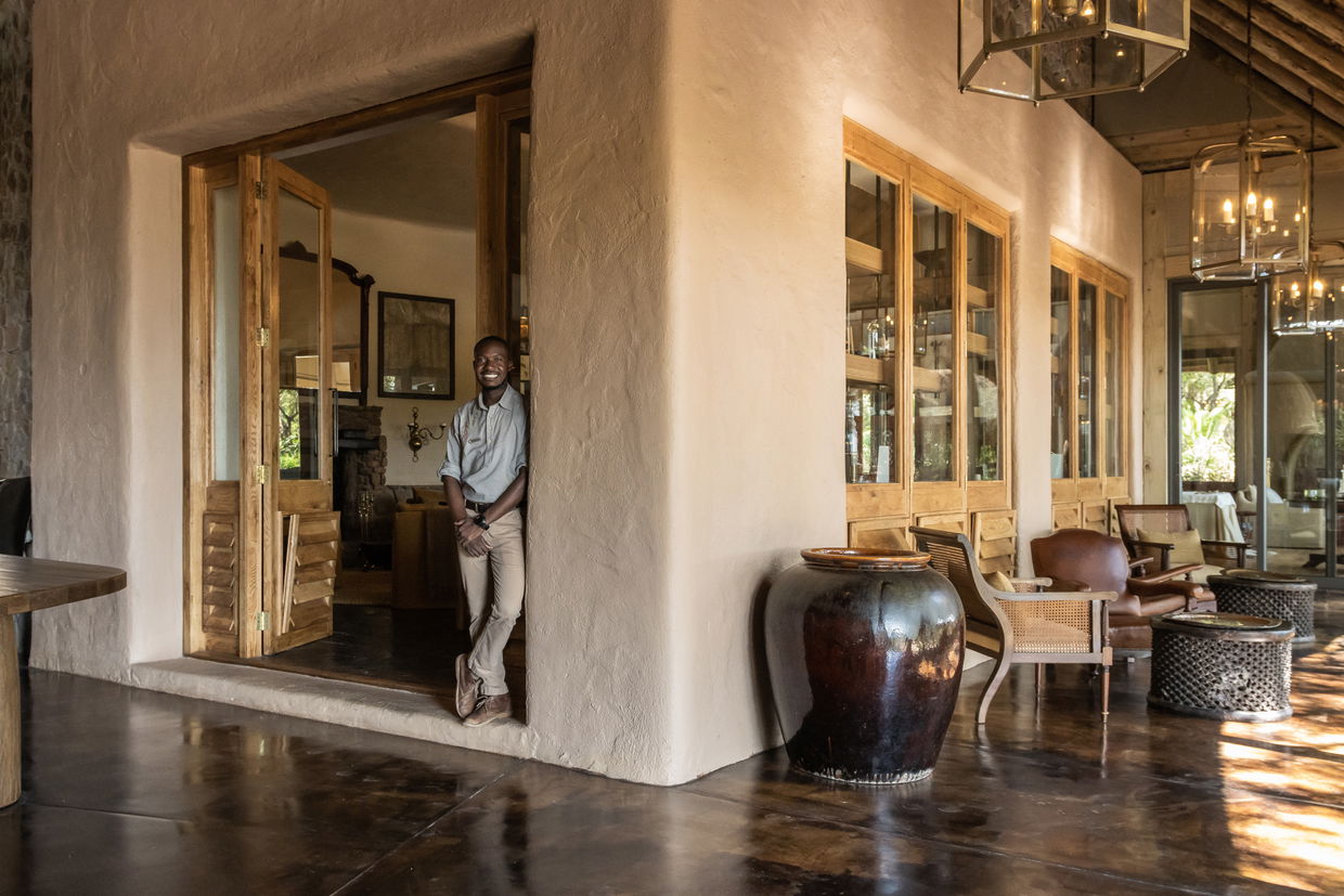 staff at conservation room entrance on deck at singita ebony lodge