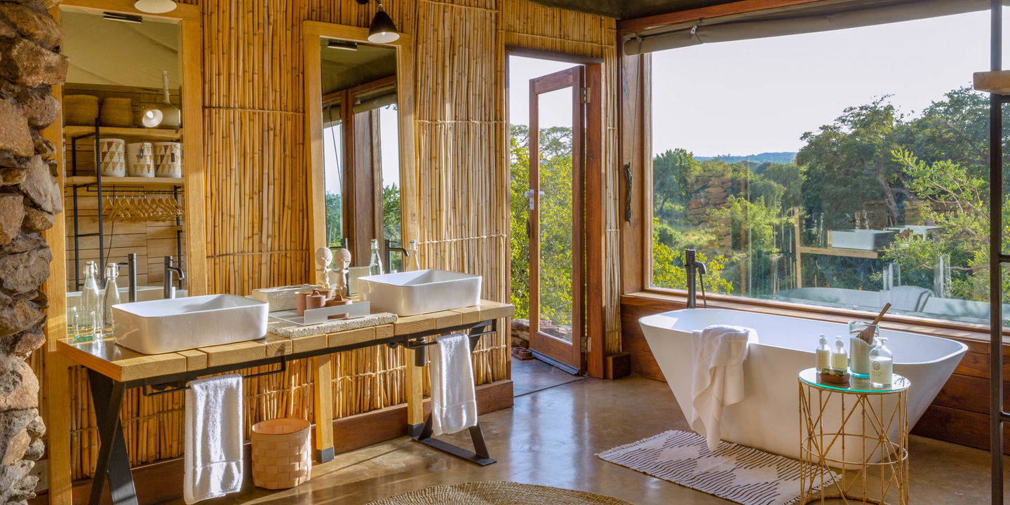 inside the bathroom facilities of a luxury suite by Singita Faru Faru lodge Serengeti