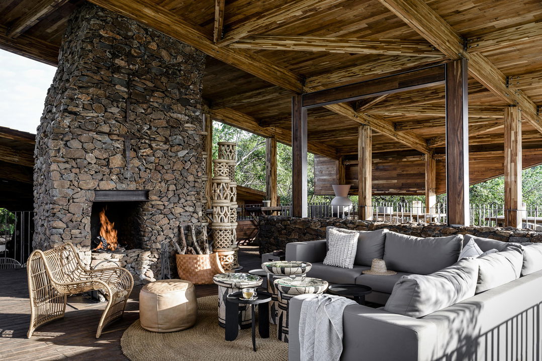 another view of lounge and fireplace in the main area of Singita Faru Faru lodge Serengeti