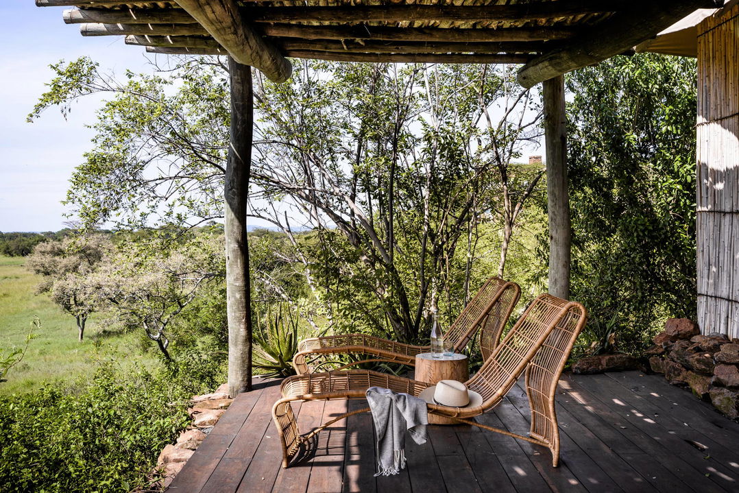 chairs on private viewing deck of a suite at Singita Faru Faru lodge Serengeti