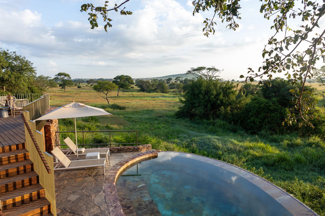 pool with loungers filmed from above at Singita Faru Faru lodge Serengeti