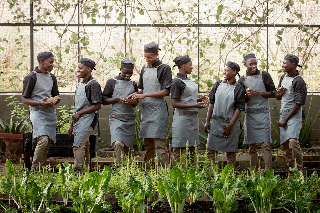 training staff in front of the interactive kitchen at Singita Faru Faru lodge Serengeti