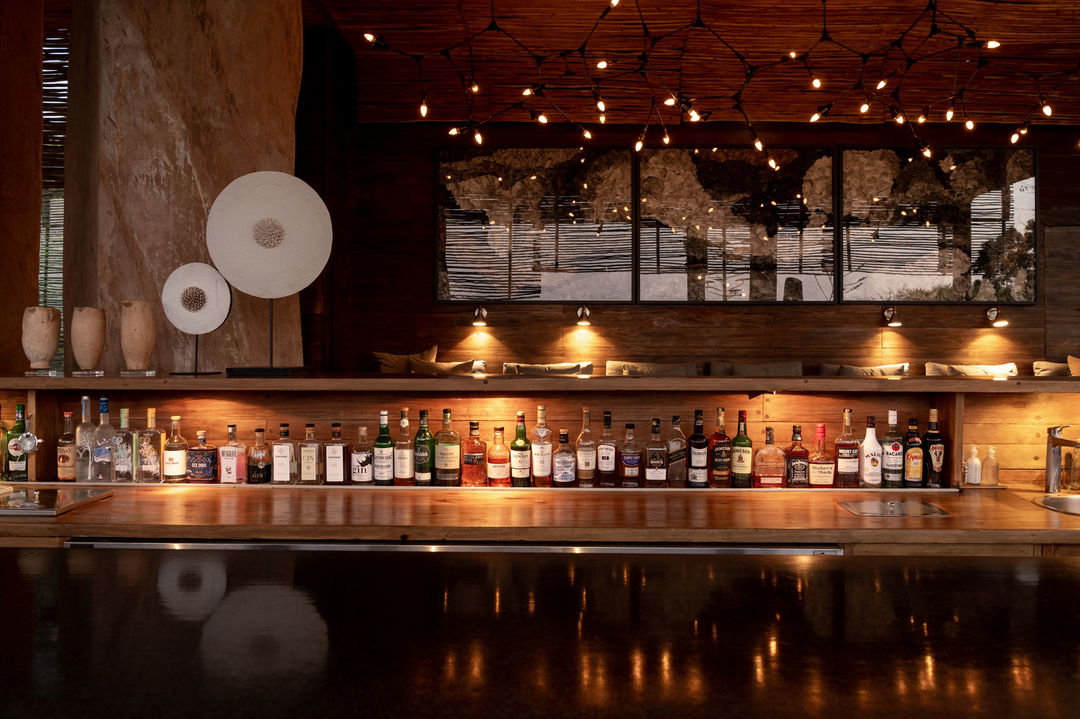 evening view of the main bar at singita lebombo lodge