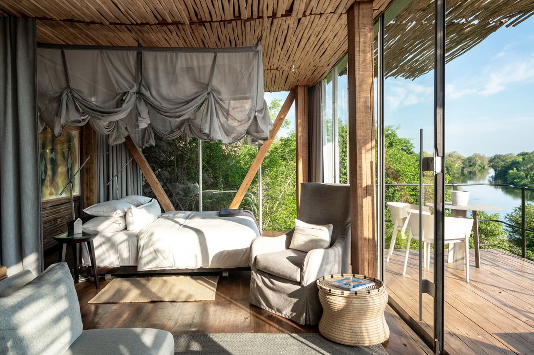 partial view of room and deck of river room at singita lebombo lodge