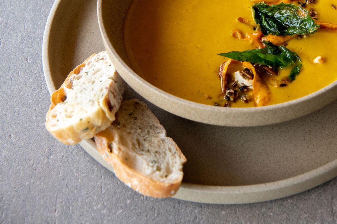 soup and bread plated for guests of Singita Sabora Tented Camp Serengeti 