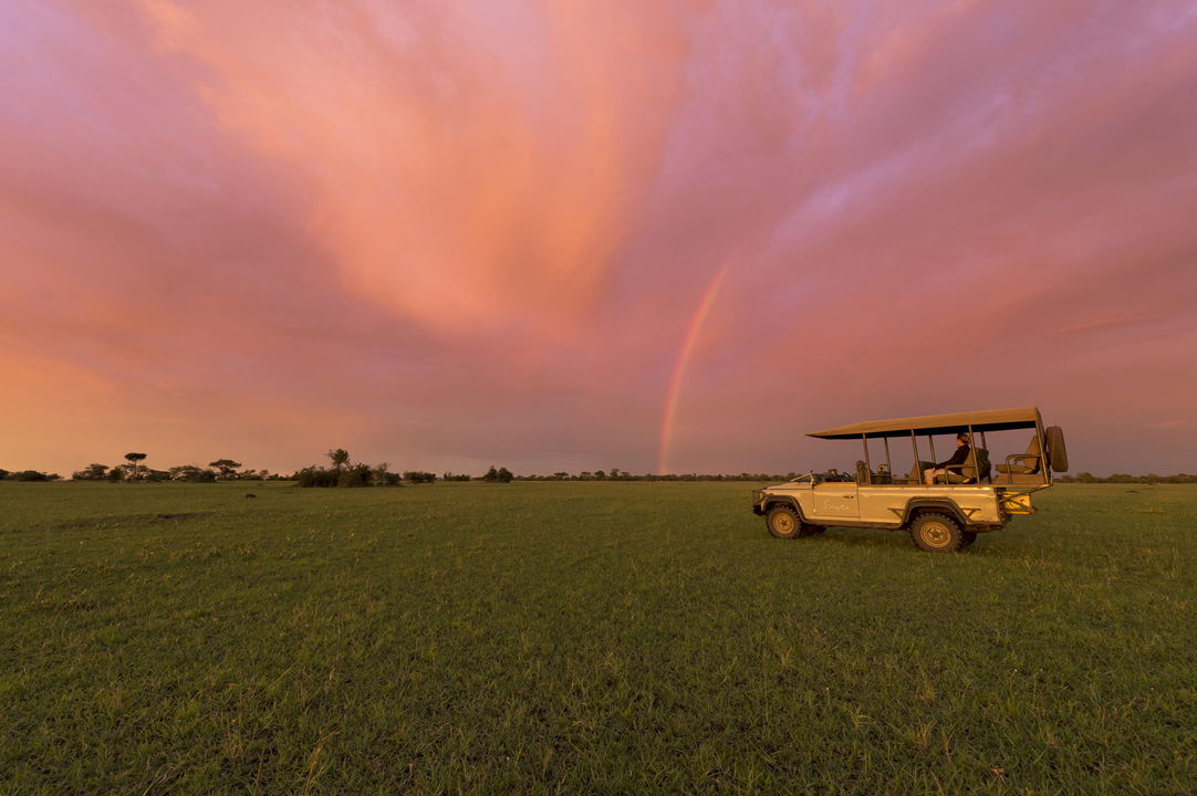 game drive at sunset on the plains of Singita Sabora Tented Camp Serengeti 
