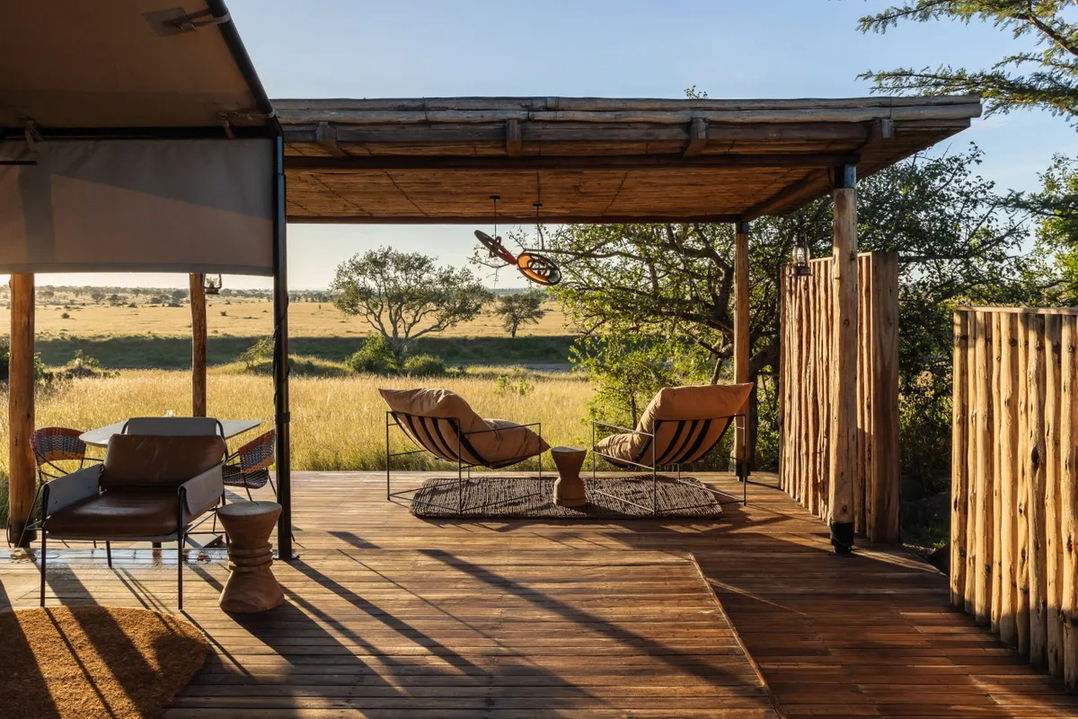 chairs on the private deck of a suite at Singita Sabora Tented Camp Serengeti 