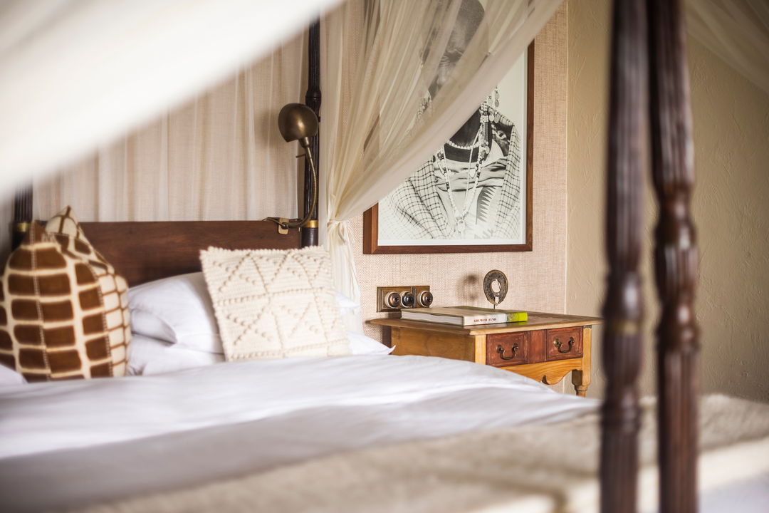 bed in bedroom of Singita Sasakwa lodge in Serengeti