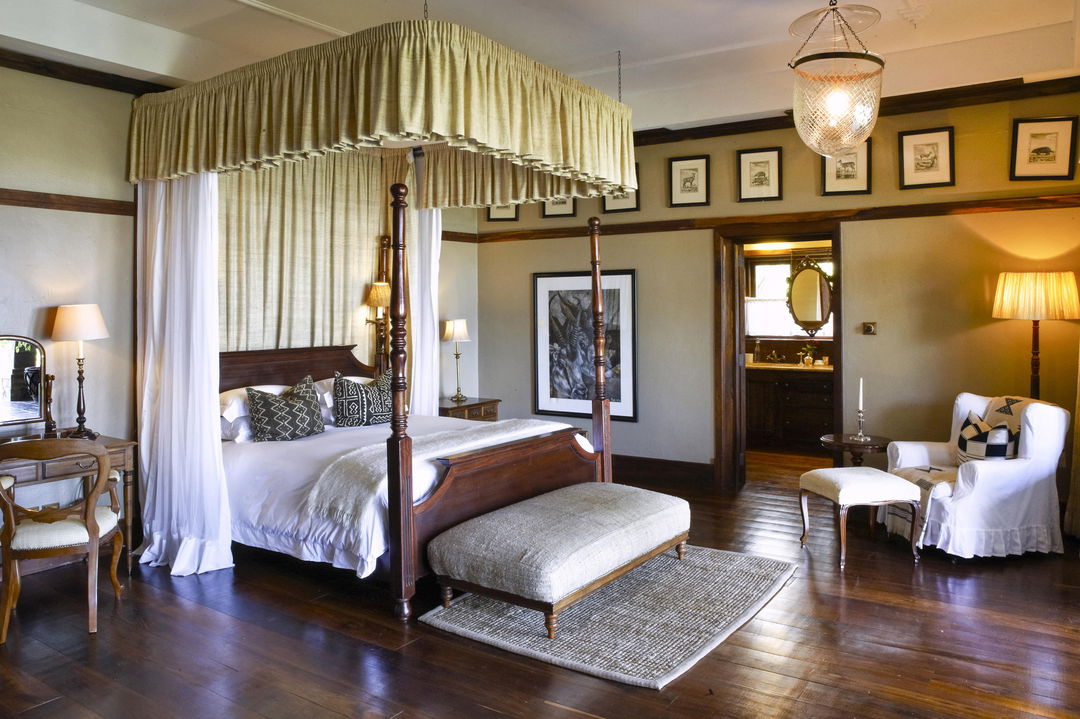 four post bed in room of Singita Sasakwa lodge in Serengeti