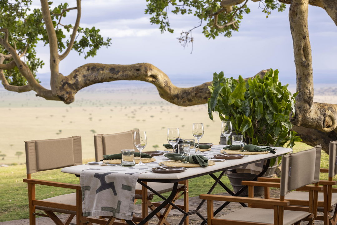 breakfast setting on viewing deck of Singita Sasakwa lodge in Serengeti