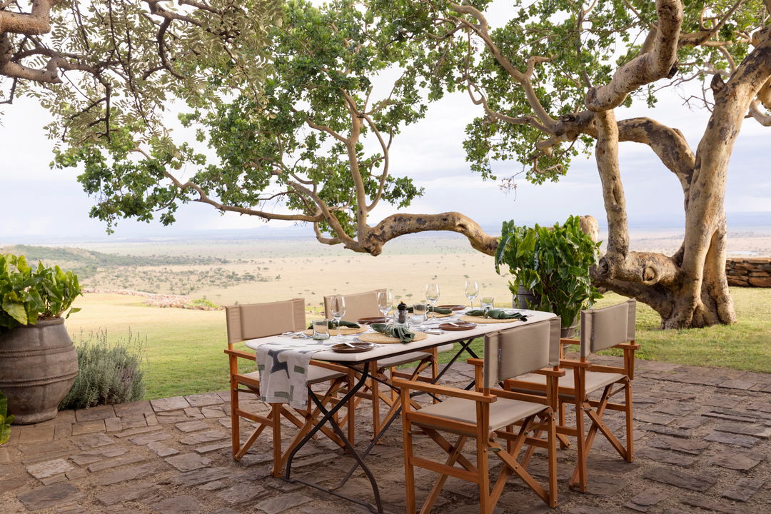 tables on the viewing deck of Singita Sasakwa lodge in Serengeti
