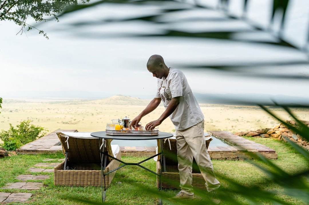 tea served at the private splash pool of a suite by Singita Sasakwa lodge in Serengeti