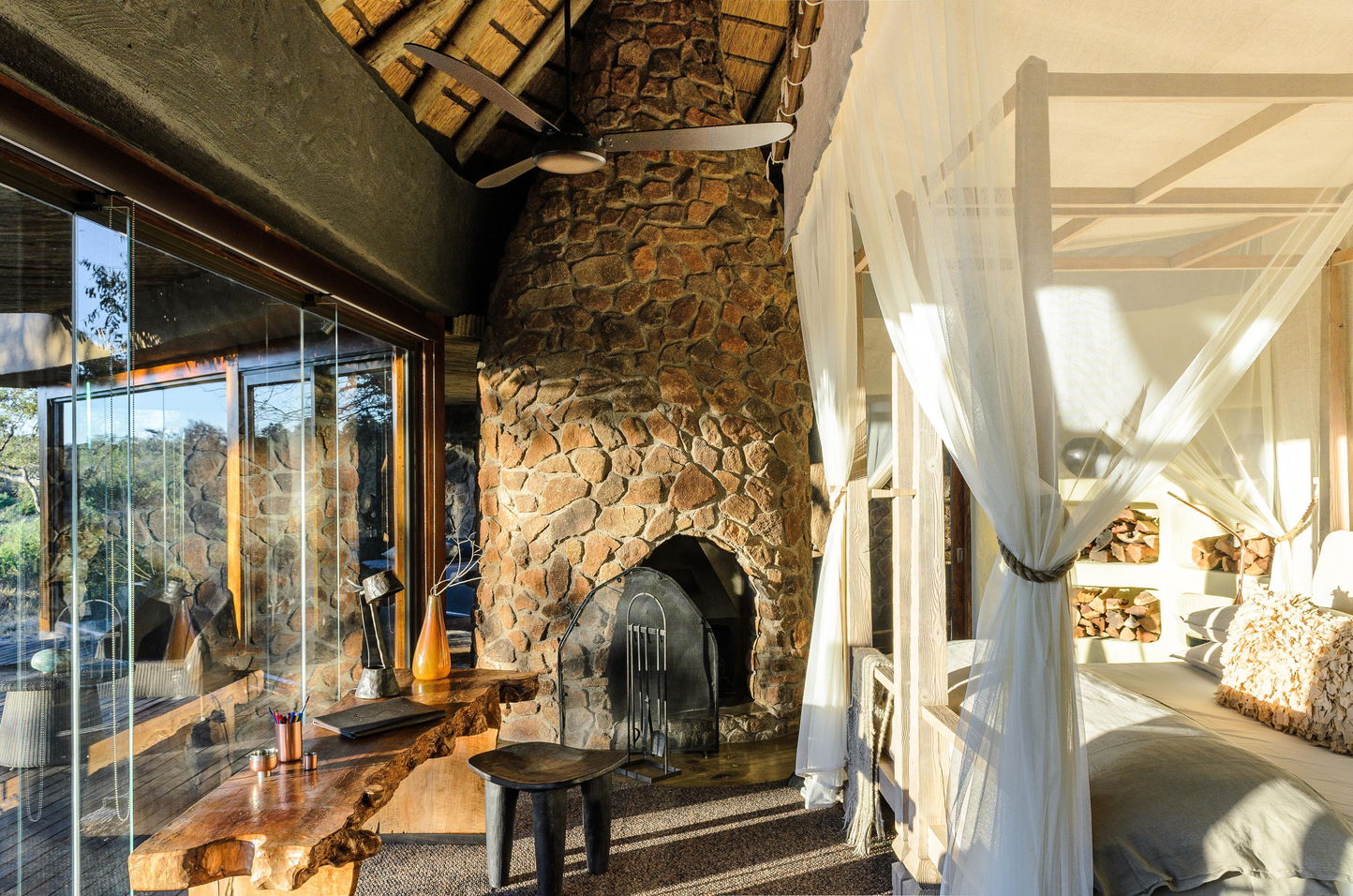 Suite interior view with big windows and luxury furniture of boulders lodge at Singita