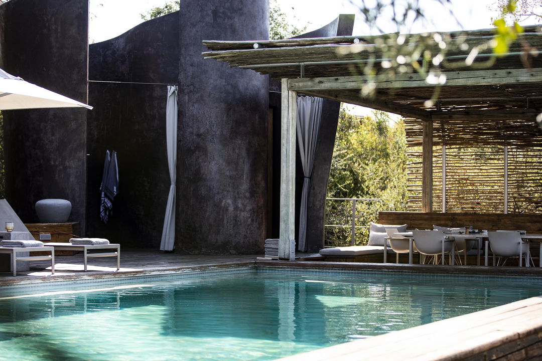 pool area of Singita Lebombo lodge with deck chair