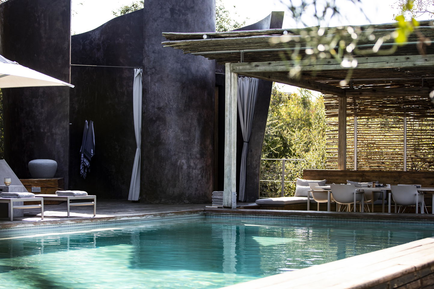 pool area of Singita Lebombo lodge with deck chair
