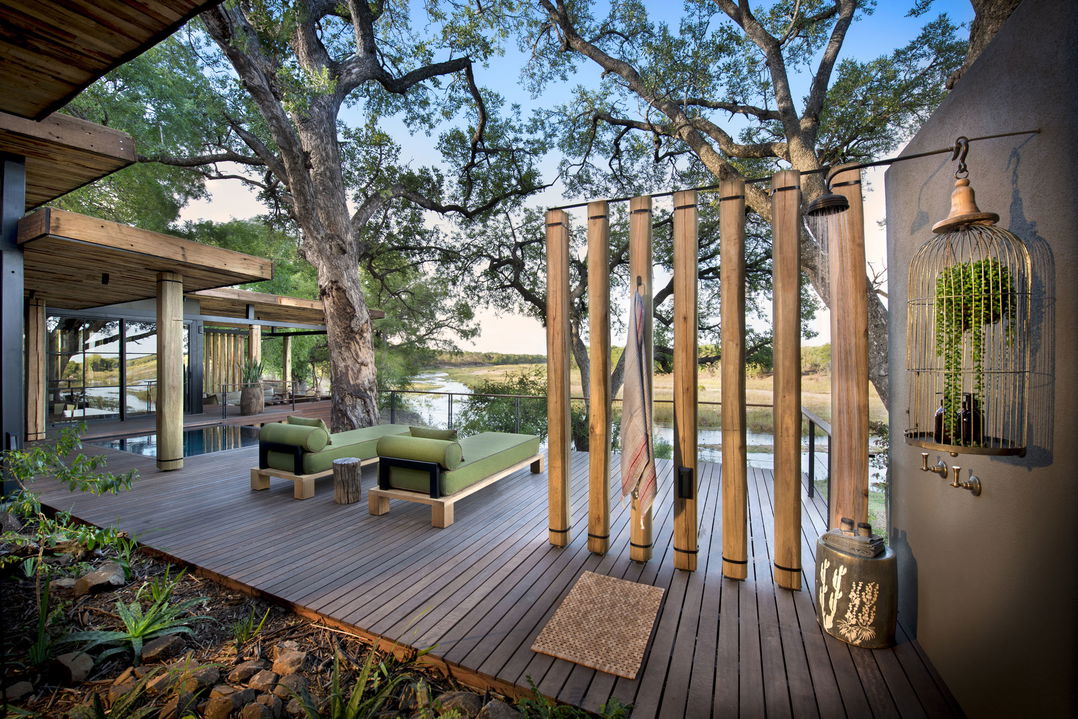 outside pool deck with loungers by room at &Beyond Tengile River Lodge Sabi Sands