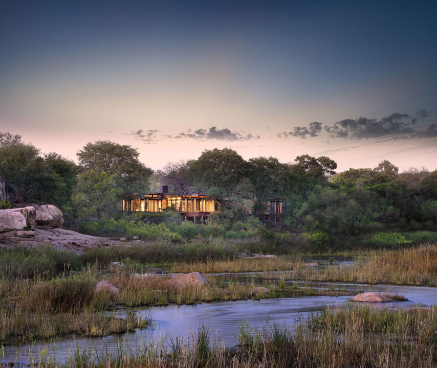 outside view of main lodge from river  at &Beyond Tengile River Lodge Sabi Sands