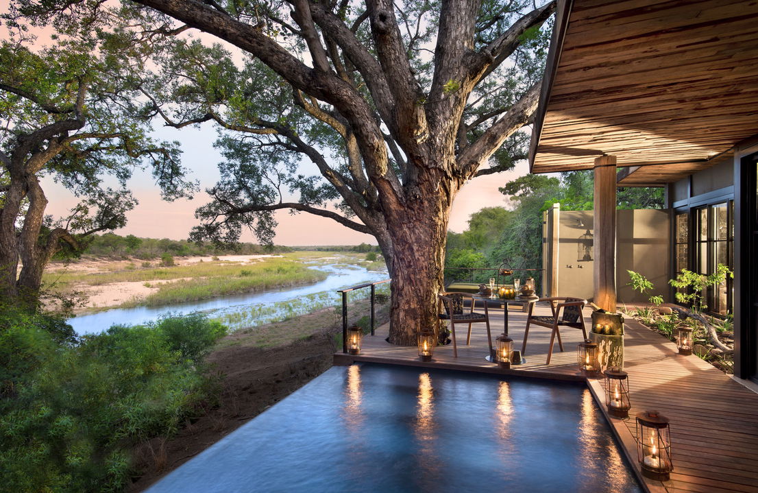 view of river beyond from pool deck at &Beyond Tengile River Lodge Sabi Sands