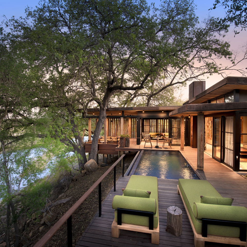 main lodge deck at sunset by andBeyond Tengile river lodge