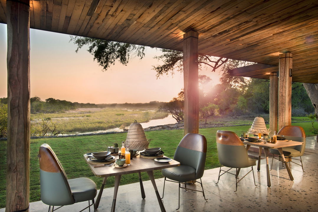 table set for breakfast with river view at &Beyond Tengile River Lodge Sabi Sands