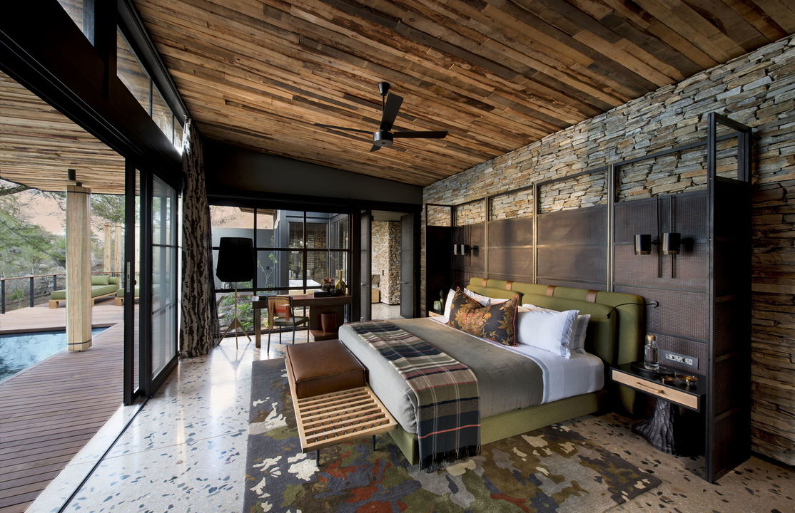 side view of bedroom and patio at &Beyond Tengile River Lodge Sabi Sands