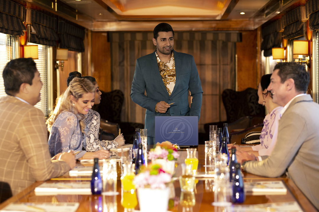 guest on a staff conference at the table of the Blue Train