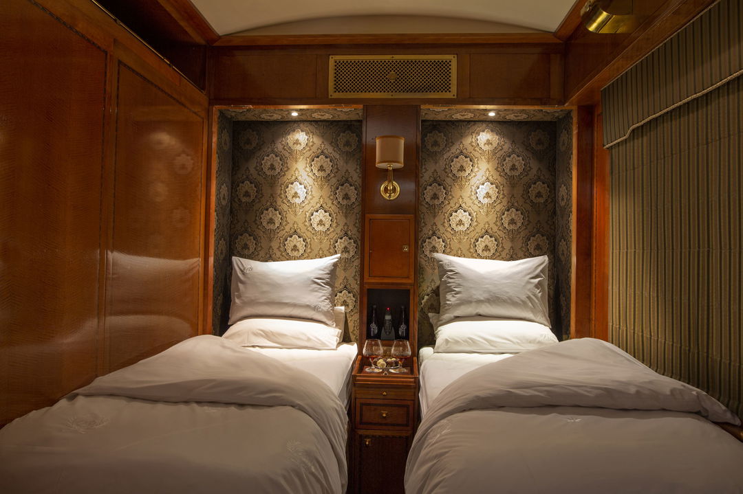 twin beds made up in luxury room on Blue Train South Africa