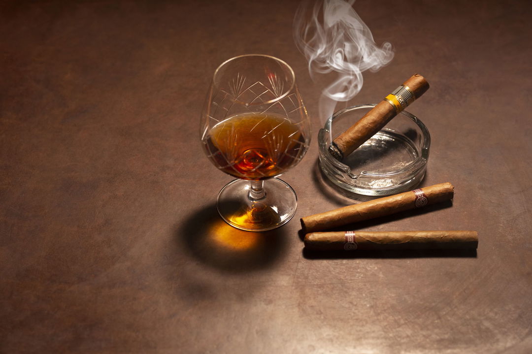cigars and cognac glass on table on Blue Train South Africa