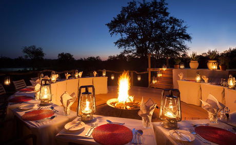 fire pit at night ready for supper at Thornybush game lodge fire pit at night ready for supper at Thornybush game lodge