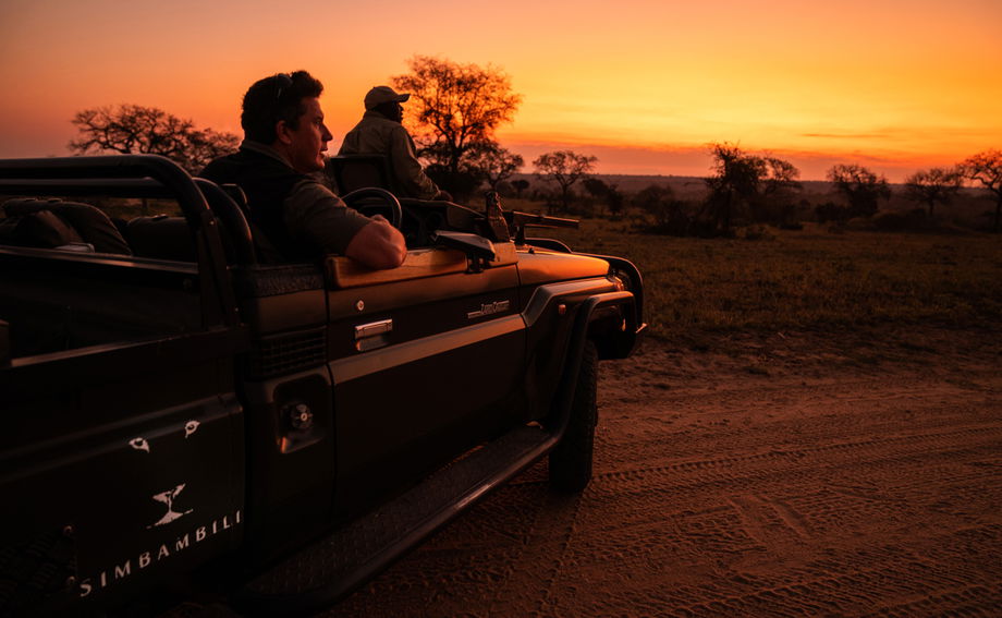 guest in safari vehicle going on night drive at Thornybush game lodges