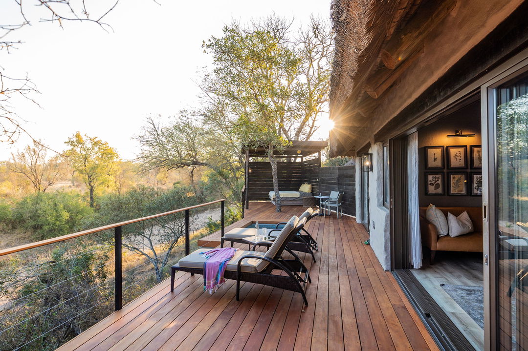deck chairs and river view at room of thornybush simbambili lodge