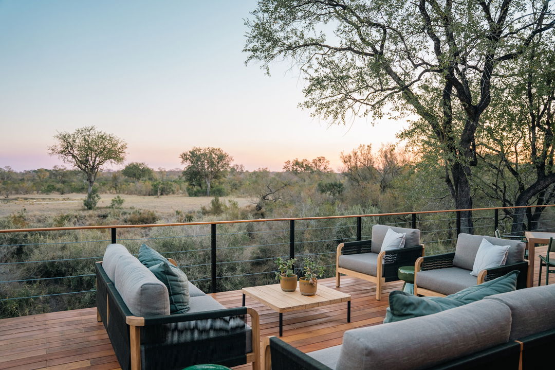 main outside deck with view of riverbed at Simbambili lodge Thornybush