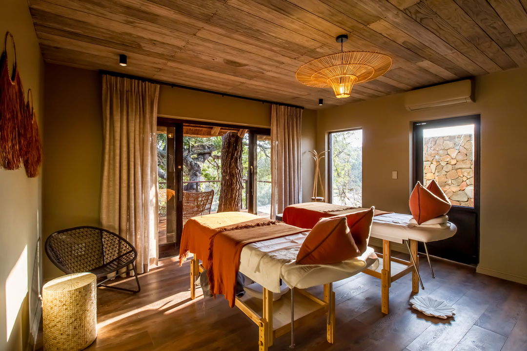 spa beds in treatment room with bush views at Simbambili lodge Thornybush
