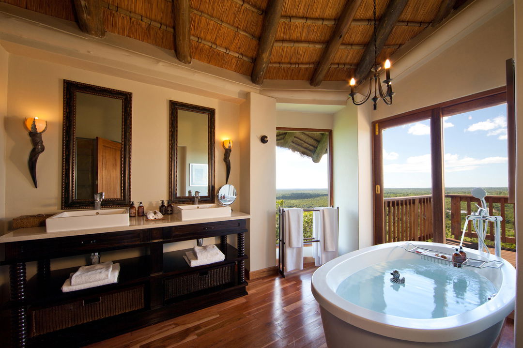inside of bathroom with a view at ulusaba cliff lodge