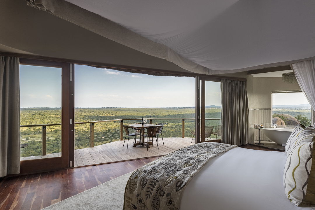 view from a luxury room with valley below at Ulusaba cliff lodge