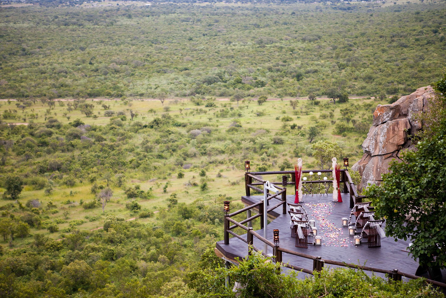 wedding setup on deck of Ulusaba cliff lodge with view of the valley below