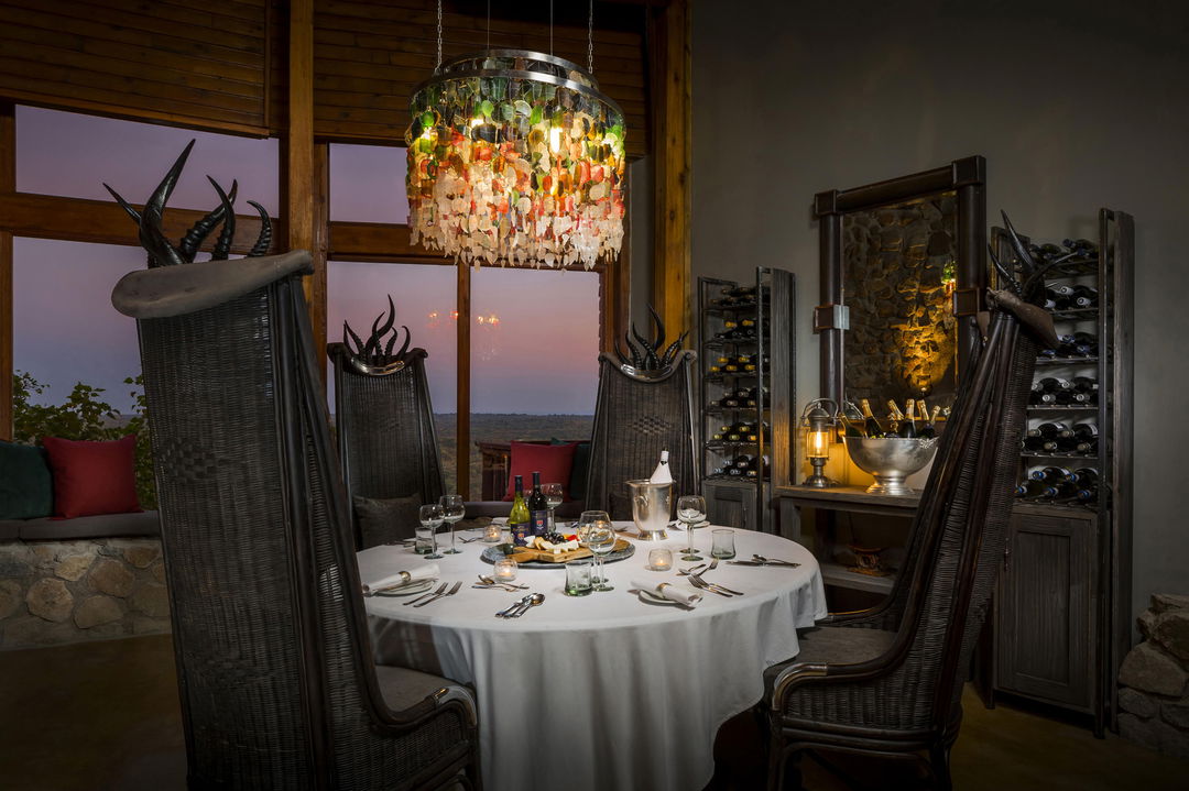 ulusaba rock lodge wine tasting room with sunset view