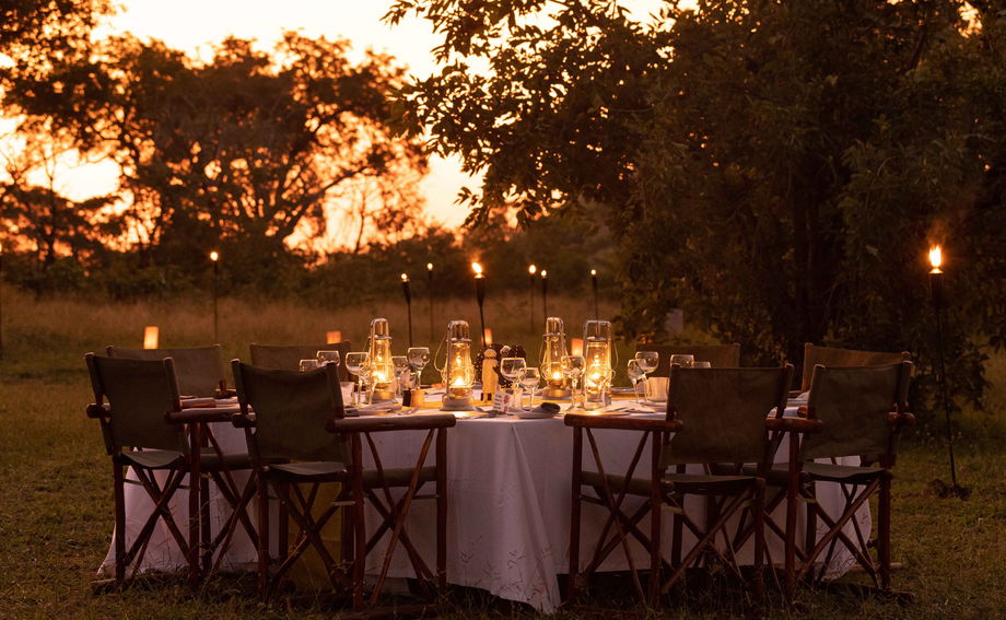 tables set at sunset for dinner in the bush at Ulusaba safari lodge tables set at sunset for dinner in the bush at Ulusaba safari lodge
