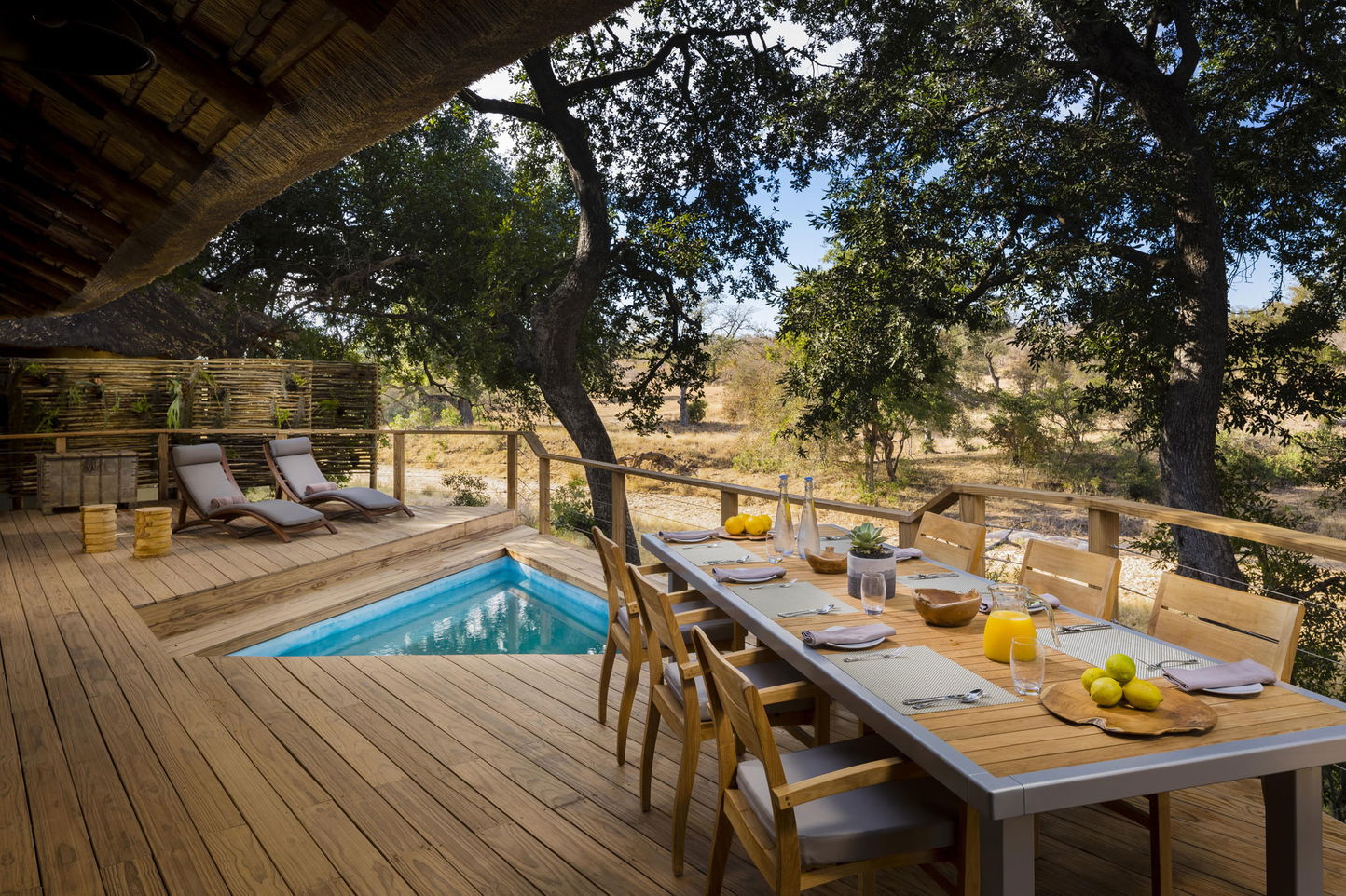 deck with table set at the safari suite of ulusaba safari lodge