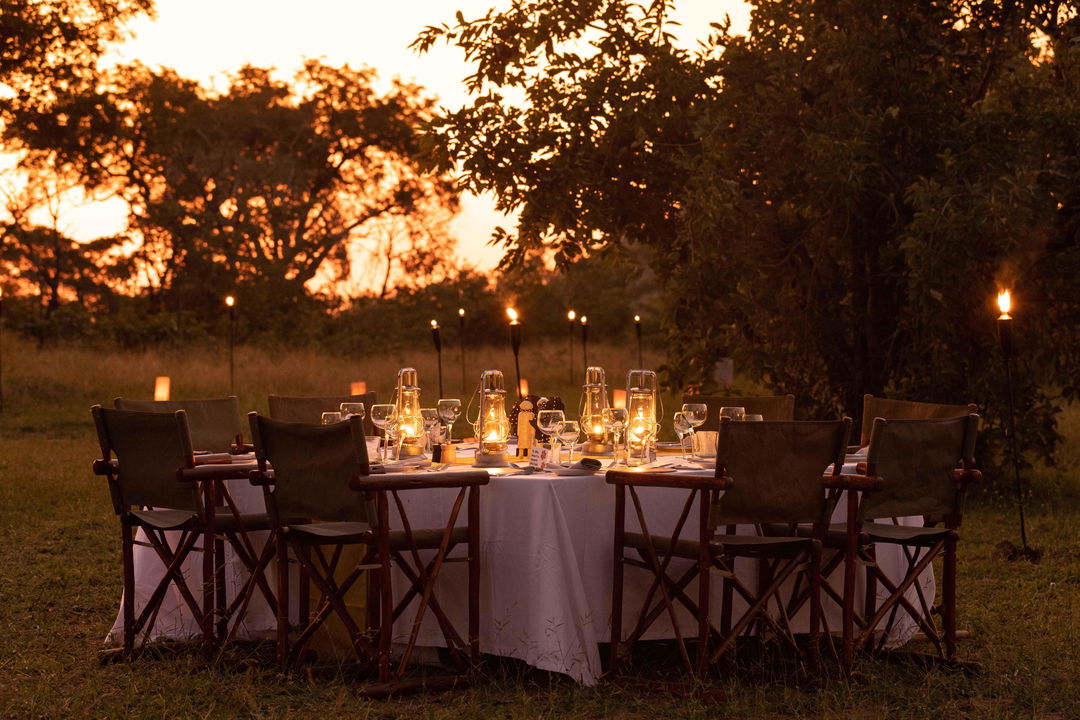 tables set at sunset for dinner in the bush at Ulusaba safari lodge