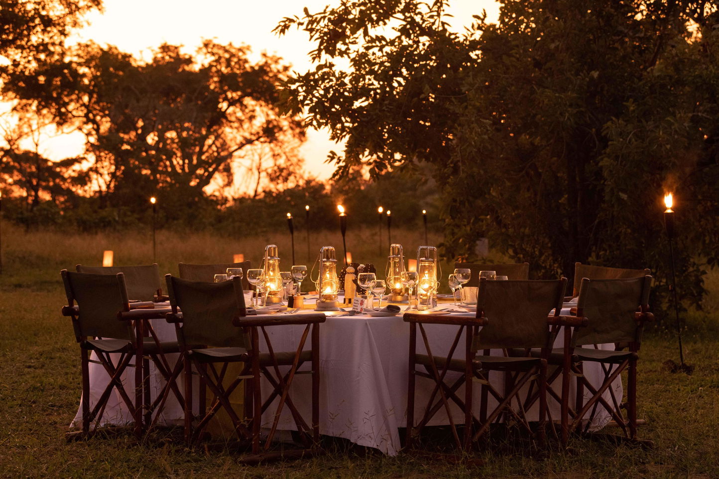 tables set at sunset for dinner in the bush at Ulusaba safari lodge