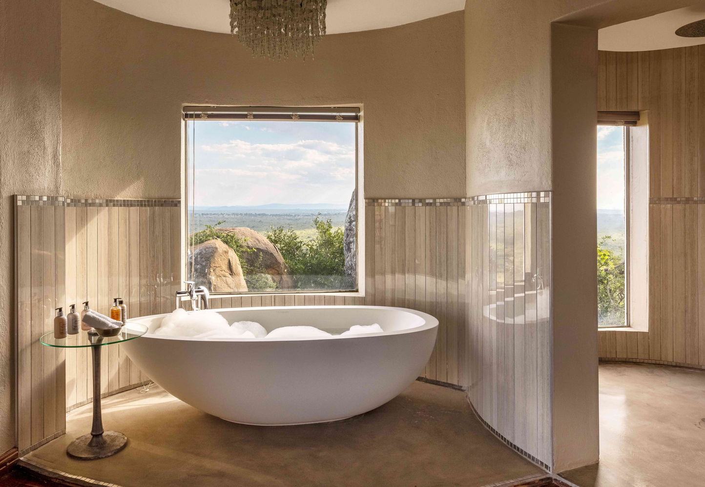 filled romantic bathtub at Ulusaba luxury lodge with views of bush 