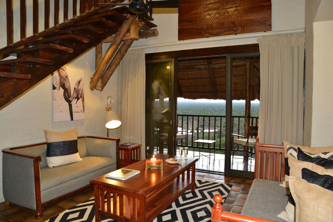 lounge area of bedroom at Victoria falls safari lodge