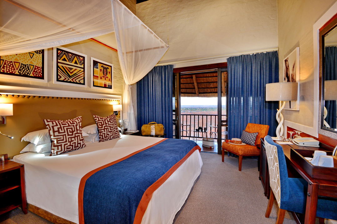 interior view of luxury room with double bed at Victoria falls safari lodge Zimbabwe