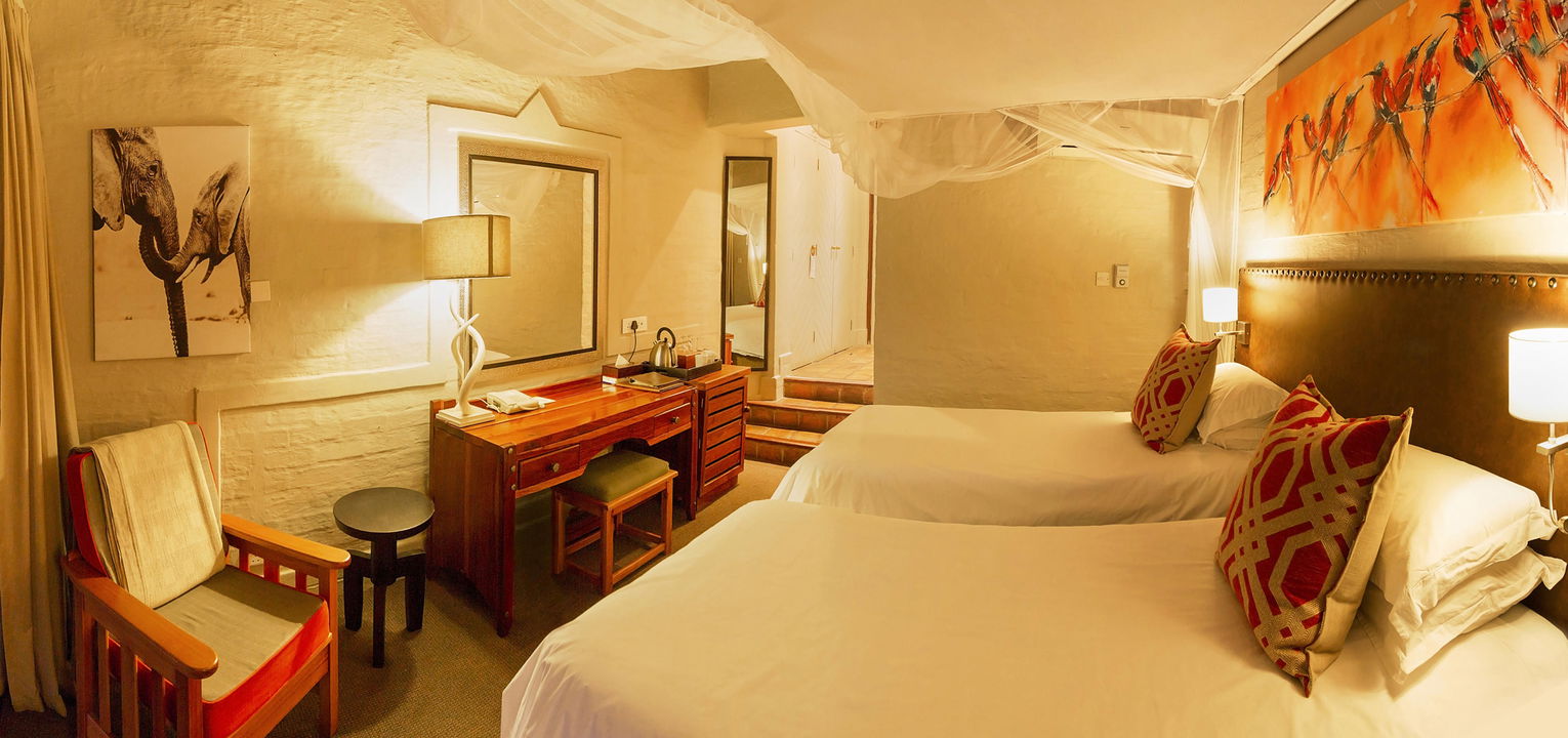 interior view of bedroom at Victoria falls safari suites
