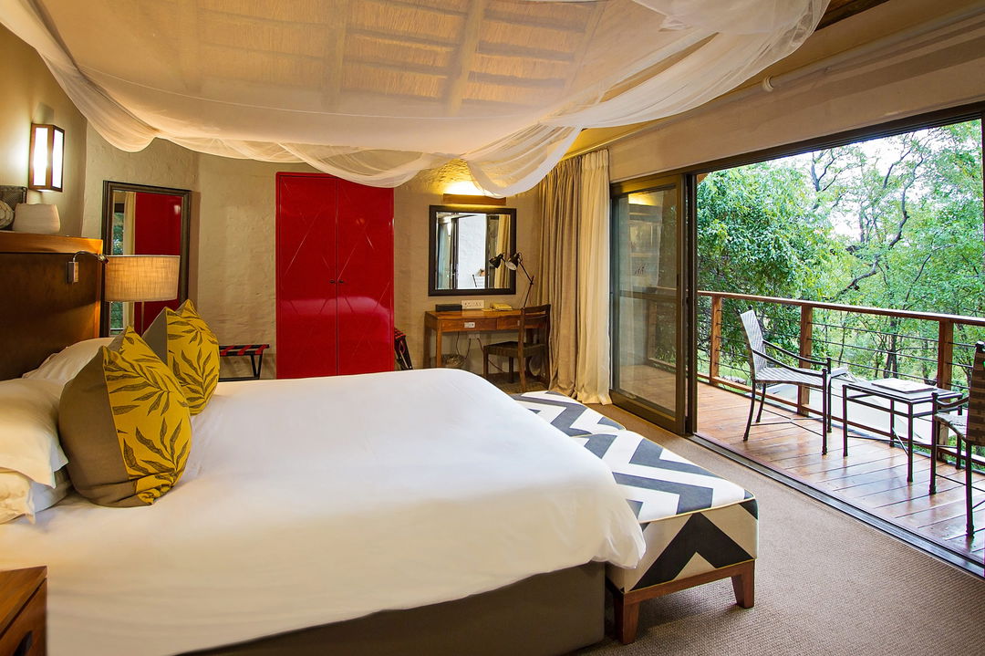 interior view of the bedroom at Victoria falls safari suites