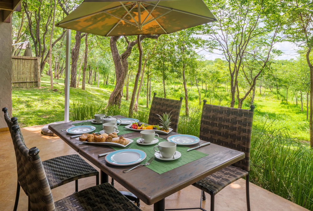breakfast setting on patio of Victoria falls safari suite
