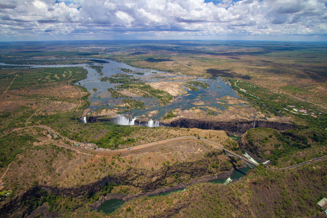 full width dry season ariel view of limited flow of Victoria falls Zimbabwe