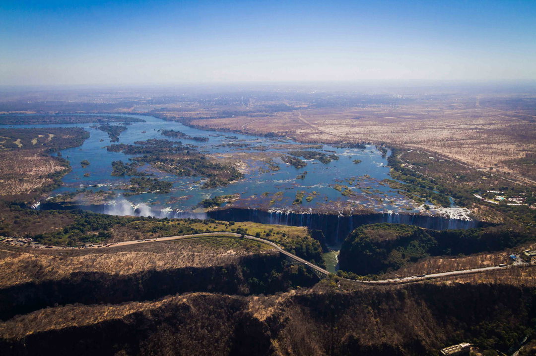 full width dry season ariel view of limited flow of Victoria falls Zimbabwe